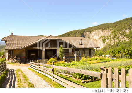 Wooden farmhouse with a vegetable garden 32322328