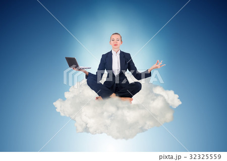 Businesswoman working in the sky and meditating Businesswoman working in the sky and meditating 32325559