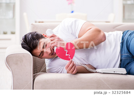 Young man in sad saint valentine concept 32325684