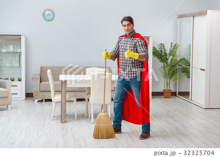 Super hero cleaner working at home 32325704