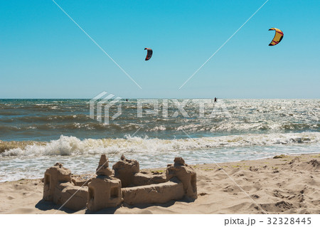 Two kitesurfs in the sea against the blue sky 32328445