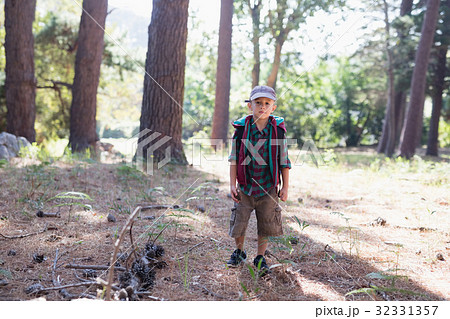 Portrait of boy hiking in forest Portrait of boy hiking in forest 32331357