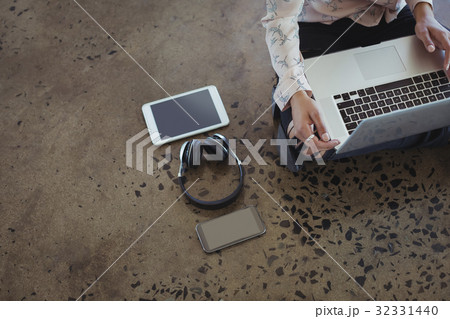 Entrepreneur working on office floor Entrepreneur working on office floor 32331440