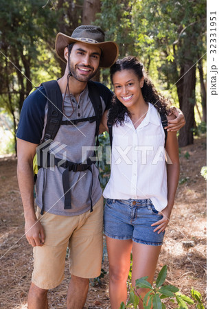 Portrait of hiker couple standing in forest 32331951