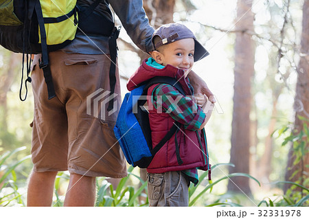 Portrait of happy boy holding hands with father Portrait of happy boy holding hands with father 32331978
