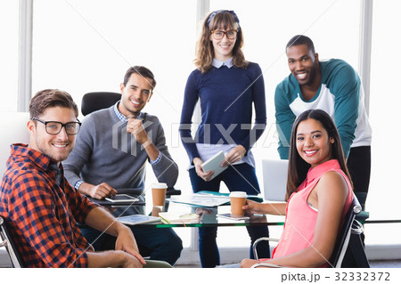 Portrait of confident business people at desk 32332372