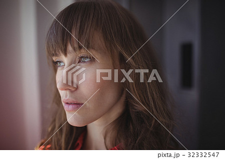 Thoughtful female designer in office 32332547