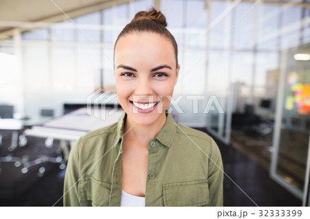 Portrait of businesswoman smiling in office 32333399
