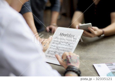 Man working on digital device network graphic overlay 32335121