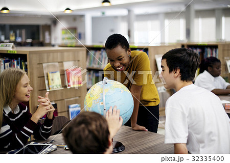 Group of diverse high school students with globe ball 32335400