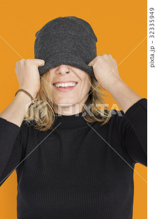 Caucasian Lady Beanie Covering Eyes Smiling Caucasian Lady Beanie Covering Eyes Smiling 32335949