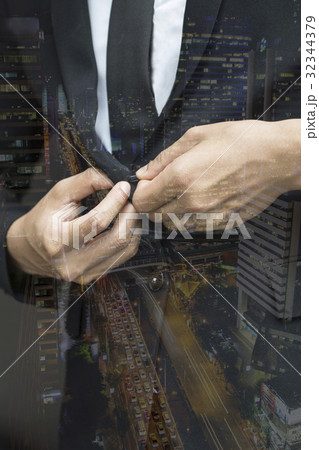 business man buttoning expensive suit jacket 32344379