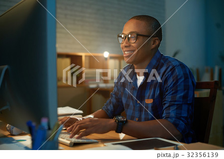 Cheerful Student Working on Project 32356139