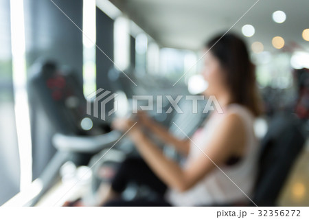blurred woman cycling burn fat on bicycle cardio blurred woman cycling burn fat on bicycle cardio 32356272