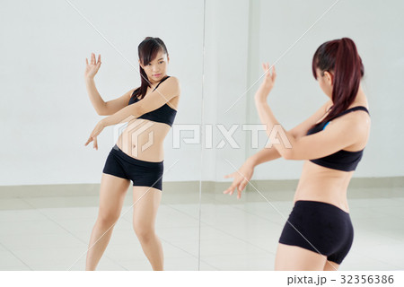 Asian Woman Wrapped up in Dancing 32356386