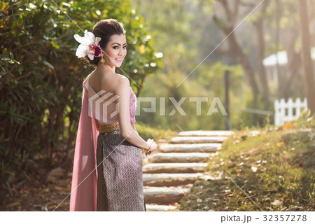 Beautiful Thai girl in Thai traditional costume Beautiful Thai girl in Thai traditional costume 32357278