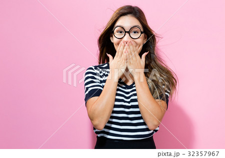 Surprised young woman posing 32357967