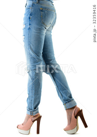 Woman in hot pink  high heels and jeans. 32359416