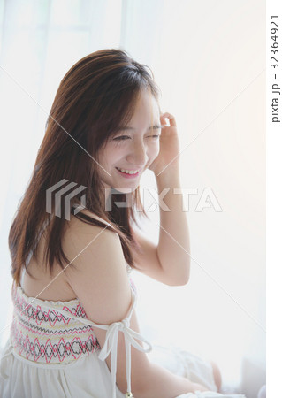Asian girl wake up in bedroom 32364921