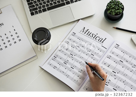 Hands working on notebook network graphic overlay Hands working on notebook network graphic overlay 32367232