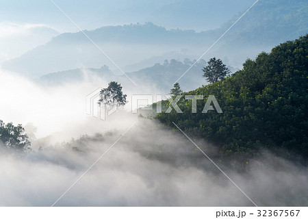View of amazing mist moving over mountains View of amazing mist moving over mountains 32367567