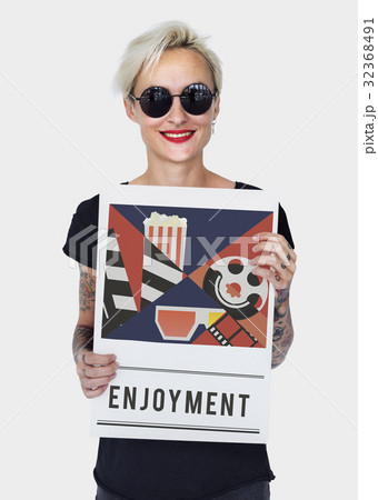 Woman holding banner of movies theatre media entertainment 32368491