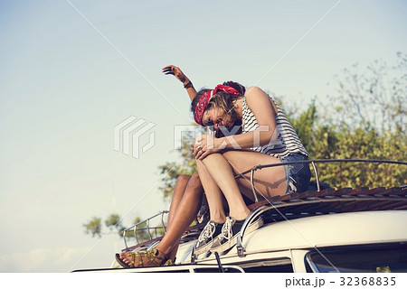 Hipster People Sitting on The Roof of The Van Road Trip Travel 32368835