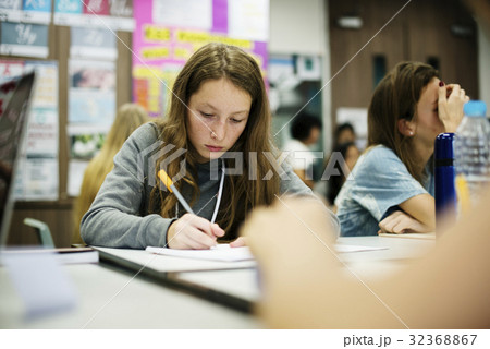 Young woman writing note in classroom 32368867