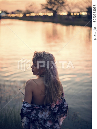 Woman Standing by the Pon in Music Festival 32368868