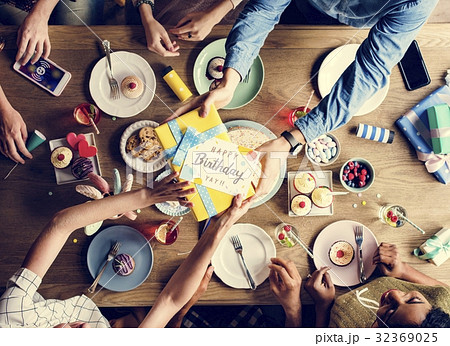 Man Giving Birthday Wishing Card to Friend 32369025