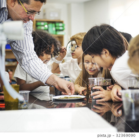 Group of diverse kindergarten students learning planting in science class Group of diverse kindergarten students learning planting in science class 32369090