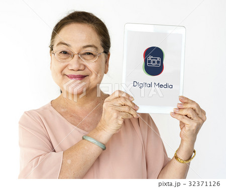 Woman holding digital device network graphic overlay Woman holding digital device network graphic overlay 32371126