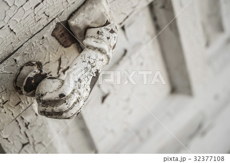 hand shaped knob of a wooden door 32377108