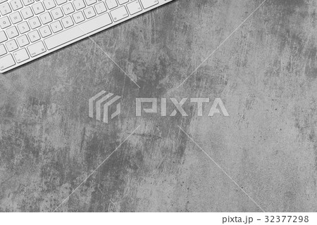 Computer keyboard and copy space on concrete table 32377298
