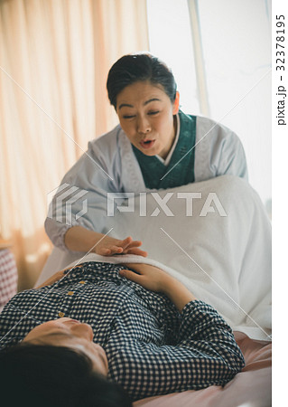 woman during pregnancy or shortly after childbirth 32378195