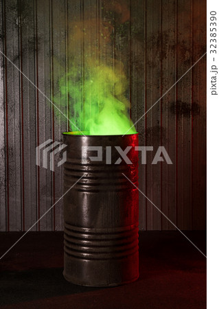 Post-apocalyptic background with old rusty barrel Post-apocalyptic background with old rusty barrel 32385390