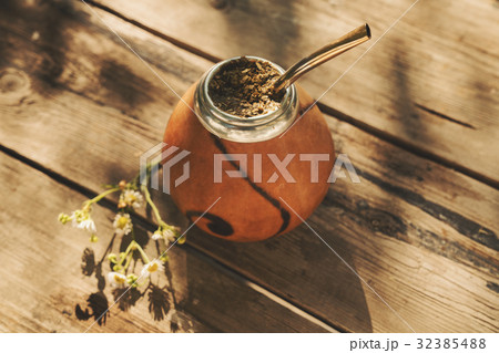 Artistic shot of Argentinean yerba mate drink in Calabash with B Artistic shot of Argentinean yerba mate drink in Calabash with B 32385488