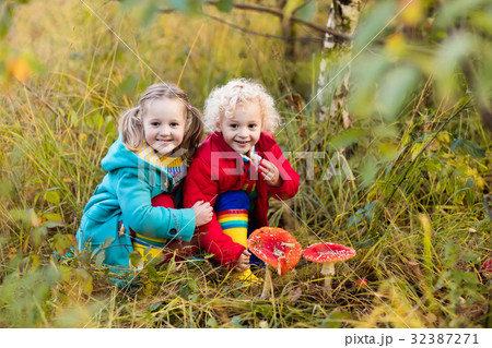 Kids playing in autumn forest Kids playing in autumn forest 32387271
