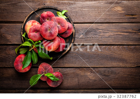 Peach, saturn or donut peaches with leaves Peach, saturn or donut peaches with leaves 32387762