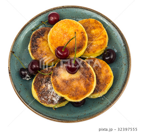 Sweet cottage cheese pancakes with powdered sugar Sweet cottage cheese pancakes with powdered sugar 32397555