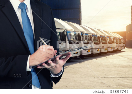Businessman is booking with blurred cargo Businessman is booking with blurred cargo 32397745