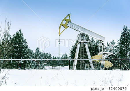 Pump jack situated in forest. Pump jack situated in forest. 32400076