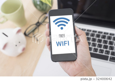 hand holding smart phone with Free wifi access  32400642