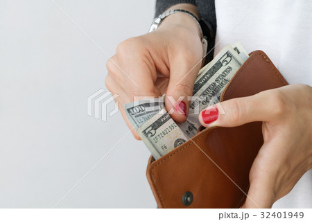 The girl holding an open leather orange slim The girl holding an open leather orange slim 32401949