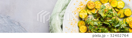 Stock fish fillet with turmeric courgettes Stock fish fillet with turmeric courgettes 32402764