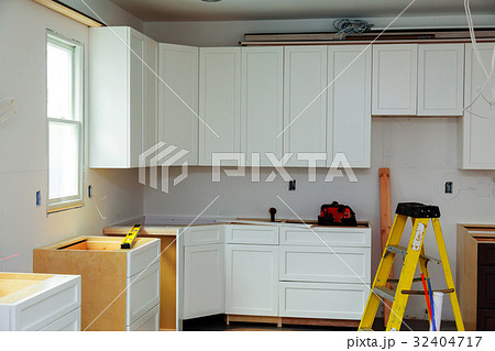 Custom kitchen cabinets in various stages  Custom kitchen cabinets in various stages  32404717