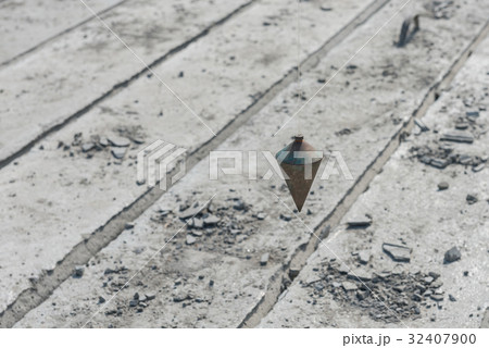 metal plumb line used in construction site metal plumb line used in construction site 32407900
