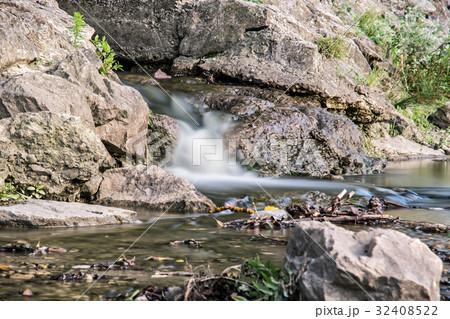 Water stream, long time photo exposure 32408522