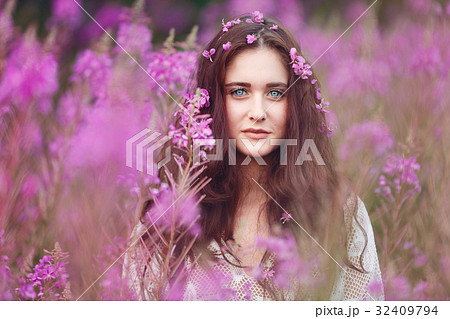 Young woman in pink flowers Young woman in pink flowers 32409794