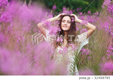 Young woman in pink flowers Young woman in pink flowers 32409795